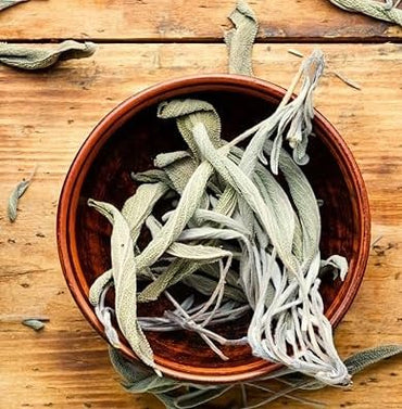 Pyrite Stone Cluster for Manifesting Financial Abundance with Selenite Bowl and White Sage Leaves