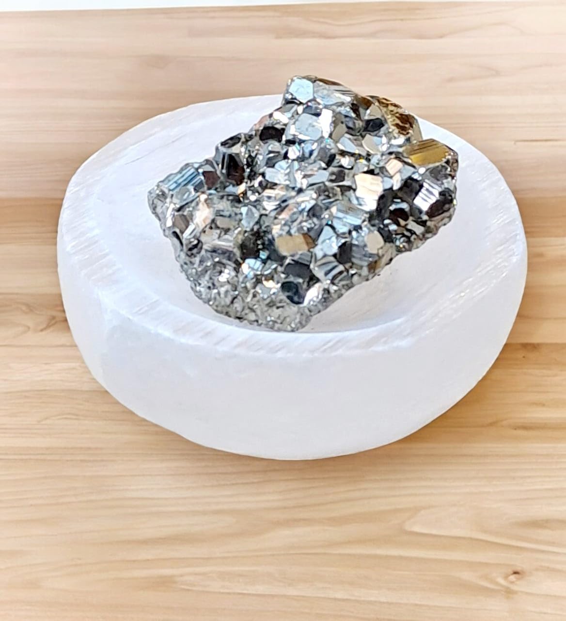Pyrite Stone Cluster for Manifesting Financial Abundance with Selenite Bowl and White Sage Leaves
